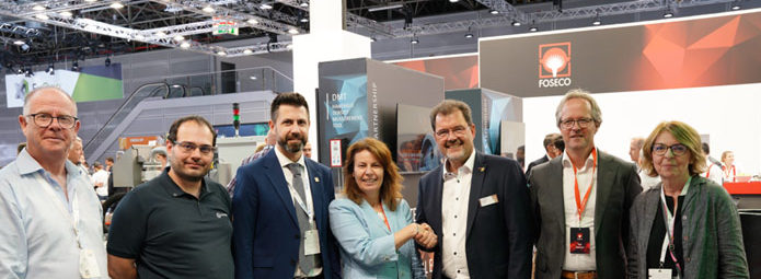 Seven people at GIFA 2023 event, celebrating the Lifetime Legacy sponsorship agreement between Foseco and WFO. Pictured (left to right): Eur. Ing. Andrew Turner (Executive Secretary, WFO), Lionel Alves (Executive Member, WFO), José Javier González (General Secretary, WFO), Karena Cancilleri (President, Foseco), Dr. Carsten Kuhlgatz (President, WFO), Rob Welland (Vice President Marketing & Technology, Foseco), and Lynn Postle (Editor, Foundry Trade Journal), with a Foseco booth in the background.