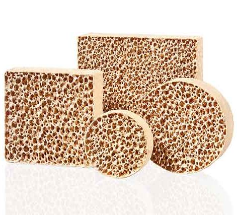 A collection of STELEX ZR Ultra ceramic foam filters in various shapes, with a distinctive honeycomb structure, against a white background