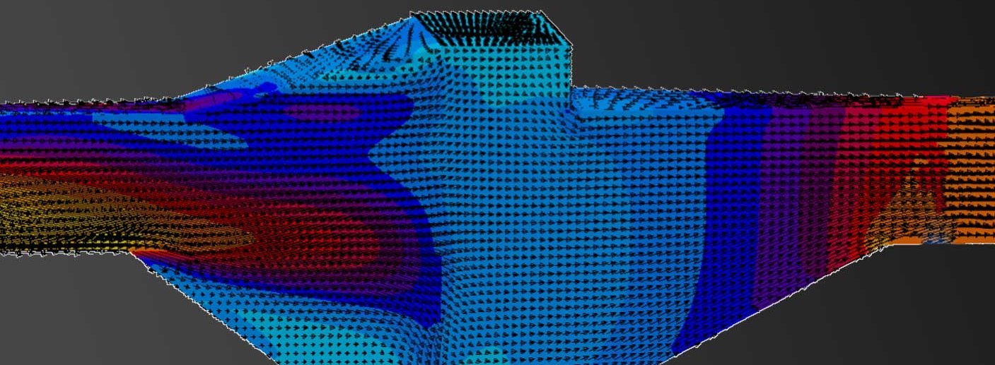 Molten metal flow simulation through a printed filter with arrows showing flow patterns in blue, red, and orange on a dark background.