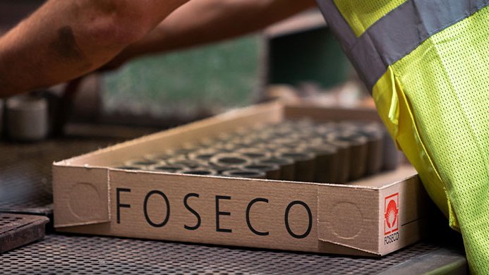 FOSECO employee packing feeding system products in a production facility
