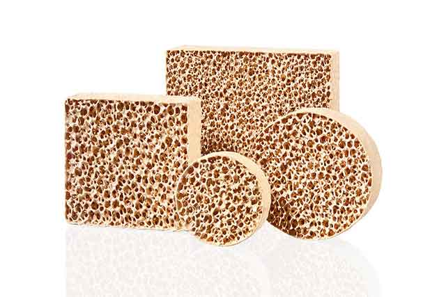 STELEX ZR Ultra Filter Range A collection of STELEX ZR Ultra ceramic foam filters in various shapes, with a distinctive honeycomb structure, against a white background
